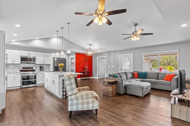 15-1884 14th Ave, Keaau, HI 96749 - living room with lofted ceiling, ceiling fan, dark wood-type flooring, recessed lighting, and baseboards