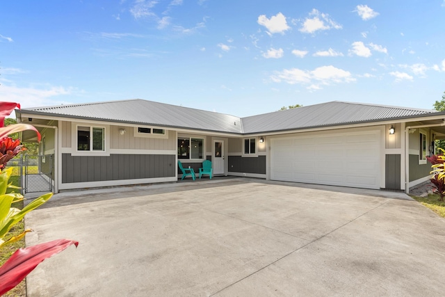 15-1884 14th Ave, Keaau, HI 96749 - single story home with a garage, driveway, and metal roof