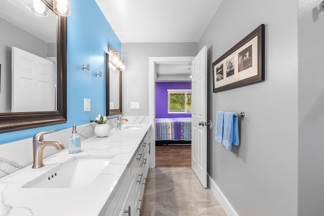 15-1884 14th Ave, Keaau, HI 96749 - full bath with double vanity, marble look tile flooring, baseboards, and ensuite bath