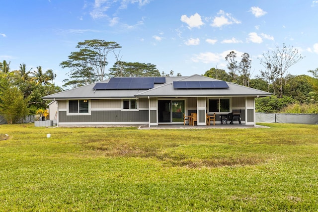 15-1884 14th Ave, Keaau, HI 96749 - back of house featuring a patio area, solar panels, and metal roof