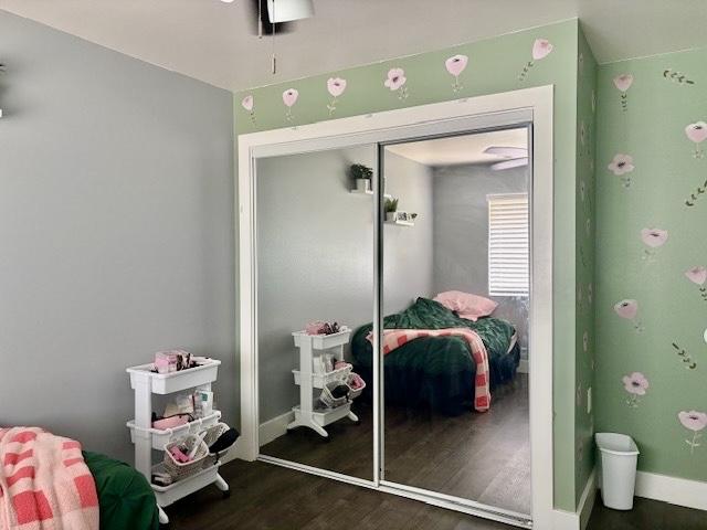 15-1884 14th Ave, Keaau, HI 96749 - bedroom with wood finished floors, a closet, and baseboards