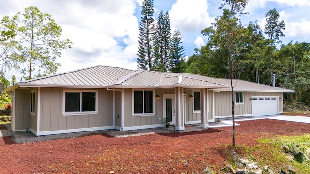 15-1047 Pilikai Rd, Keaau, HI 96749 - single story home featuring a garage, driveway, and metal roof