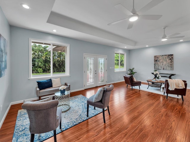 15-1047 Pilikai Rd, Keaau, HI 96749 - living room with recessed lighting, a tray ceiling, wood finished floors, ceiling fan, and baseboards