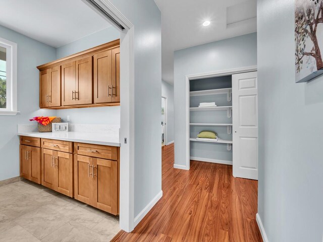 15-1047 Pilikai Rd, Keaau, HI 96749 - bar featuring baseboards and light wood-style flooring