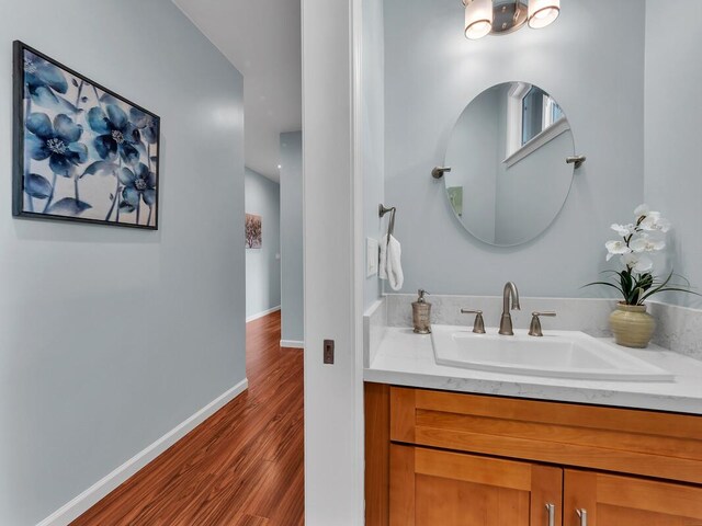 15-1047 Pilikai Rd, Keaau, HI 96749 - bathroom featuring vanity, wood finished floors, and baseboards