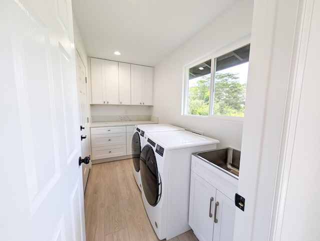 15-2812 Lai St, Pahoa, HI 96778 - laundry area featuring cabinet space, separate washer and dryer, light wood-style floors, and recessed lighting
