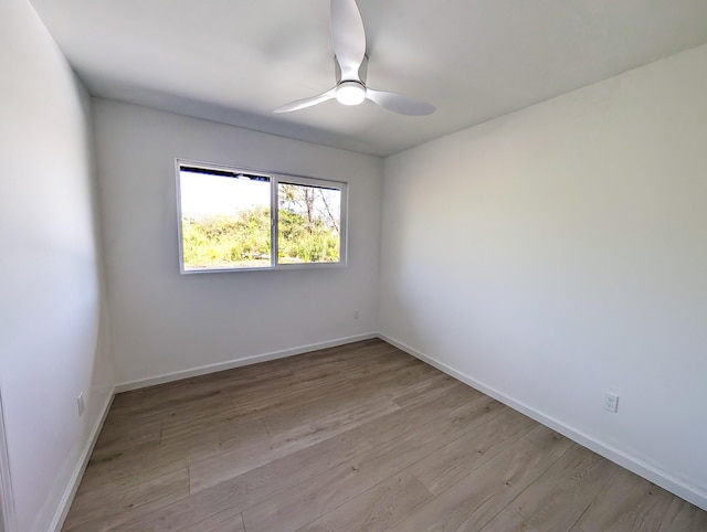 15-2812 Lai St, Pahoa, HI 96778 - spare room with ceiling fan, light wood finished floors, and baseboards