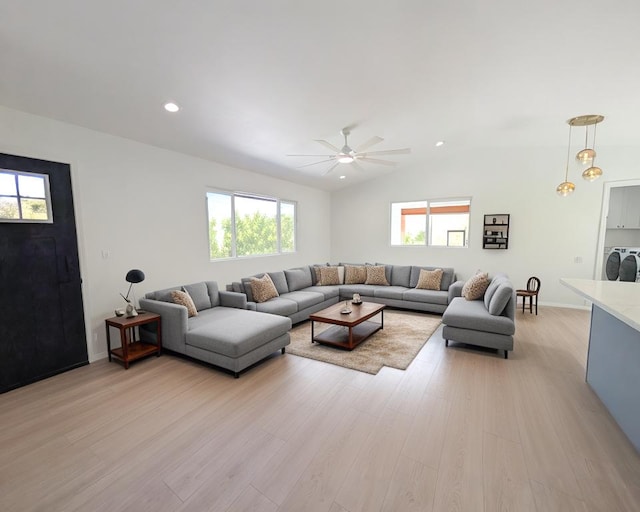 15-2812 Lai St, Pahoa, HI 96778 - living room featuring light wood finished floors, ceiling fan, lofted ceiling, washing machine and clothes dryer, and baseboards