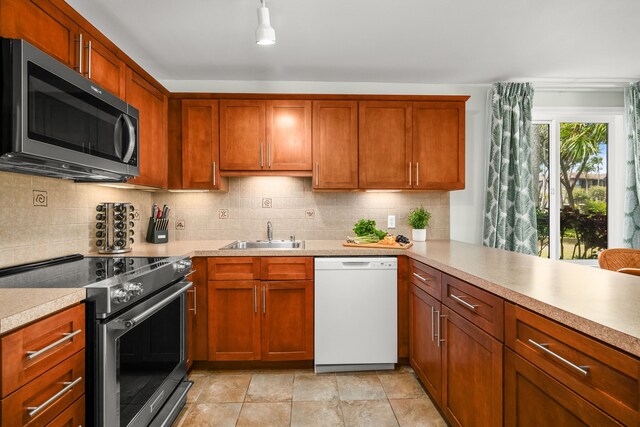 4-1250 Kuhio Hwy Unit H104, Kapaa, HI 96746 - kitchen with appliances with stainless steel finishes, a sink, light countertops, and tasteful backsplash