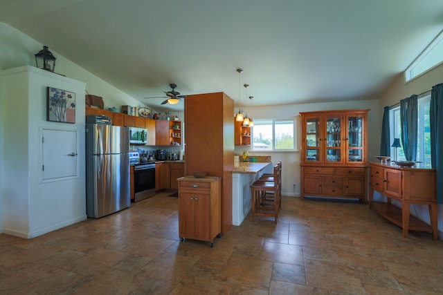 15-1517 7th Ave, Keaau, HI 96749 - kitchen with stainless steel appliances, open shelves, lofted ceiling, stone tile floors, and baseboards