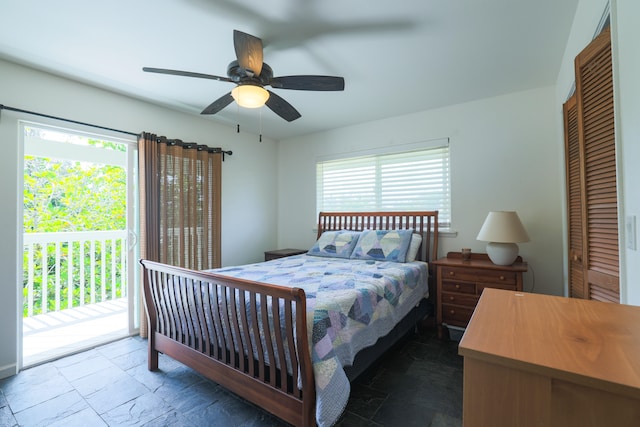 15-1517 7th Ave, Keaau, HI 96749 - bedroom with stone tile flooring, access to outside, and multiple windows
