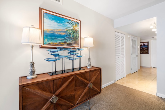 75-6106 Alii Dr Unit 208, Kailua-Kona, HI 96740 - hallway with baseboards and carpet floors