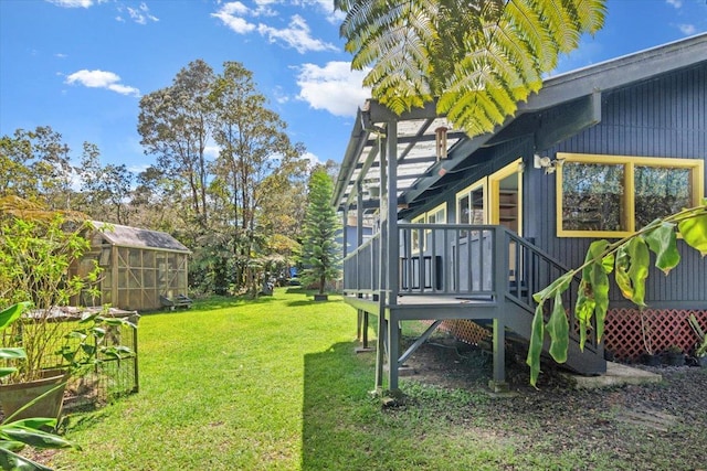11-3953 Liona St, Volcano, HI 96785 - view of green lawn featuring an exterior structure, an outbuilding, and a deck