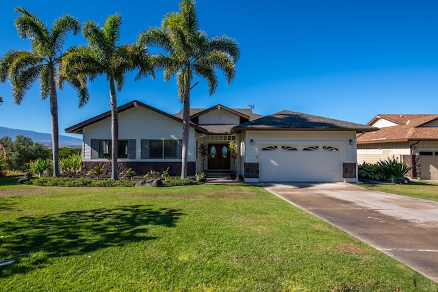 68-3932 Mulei Pl, Waikoloa, HI 96738 - view of front facade with an attached garage, a front yard, concrete driveway, and french doors