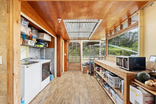 32-520 Piha Kahuku Rd, Ninole, HI 96773 - washroom featuring separate washer and dryer and light wood-style floors