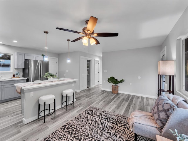 11-3063-A Puolani St, Volcano, HI 96785 - living area featuring light wood finished floors, ceiling fan, baseboards, and recessed lighting