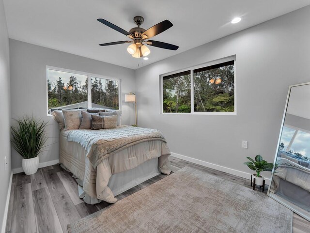 11-3063-A Puolani St, Volcano, HI 96785 - bedroom featuring baseboards, wood finished floors, recessed lighting, and ceiling fan