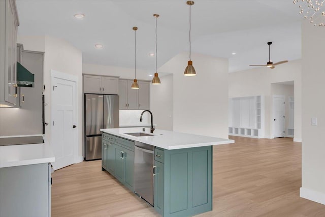 15-1616 7th Ave, Keaau, HI 96749 - kitchen with a sink, stainless steel appliances, light wood-type flooring, light countertops, and a kitchen island with sink