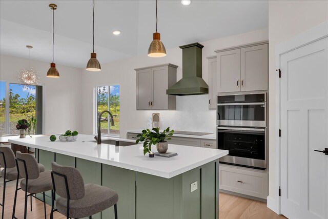 15-1616 7th Ave, Keaau, HI 96749 - kitchen with wall chimney exhaust hood, a sink, double oven, light countertops, and recessed lighting