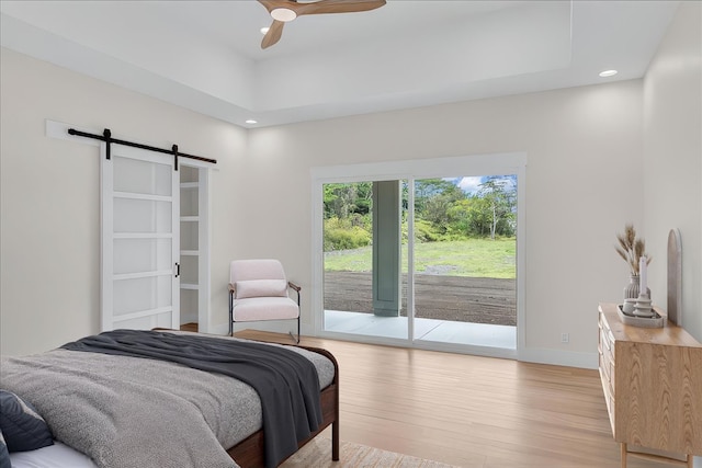 15-1616 7th Ave, Keaau, HI 96749 - bedroom with access to exterior, light wood-style flooring, a barn door, baseboards, and recessed lighting