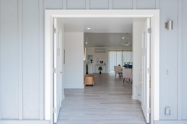 68-1787 Niu Haohao Pl, Waikoloa, HI 96738 - hall with an AC wall unit, light wood-type flooring, and baseboards