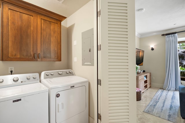 2373 Hoohu Rd Unit B111, Koloa, HI 96756 - laundry room featuring cabinet space, washer and clothes dryer, electric panel, ornamental molding, and light tile patterned floors