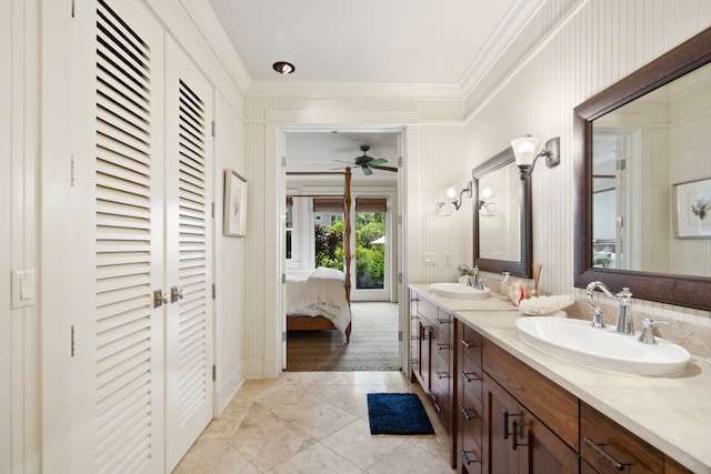 2373 Hoohu Rd Unit B111, Koloa, HI 96756 - ensuite bathroom with crown molding, double vanity, a closet, a ceiling fan, and tile patterned floors