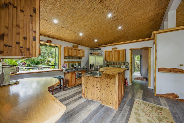 14-3401 Pakalana Rd, Pahoa, HI 96778 - kitchen with a sink, brown cabinets, dark wood-style floors, a kitchen island with sink, and recessed lighting