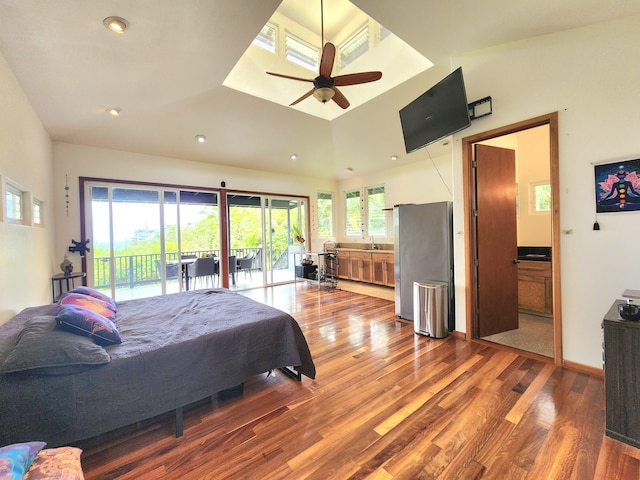 13-831 Malama St, Pahoa, HI 96778 - bedroom with freestanding refrigerator, wood finished floors, access to exterior, recessed lighting, and ensuite bath