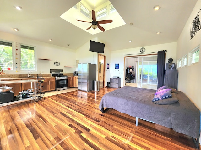 13-831 Malama St, Pahoa, HI 96778 - bedroom with freestanding refrigerator, multiple windows, light wood finished floors, lofted ceiling, and recessed lighting