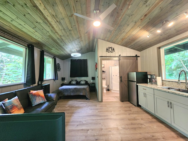 13-831 Malama St, Pahoa, HI 96778 - kitchen featuring a barn door, freestanding refrigerator, lofted ceiling, open floor plan, and wood ceiling