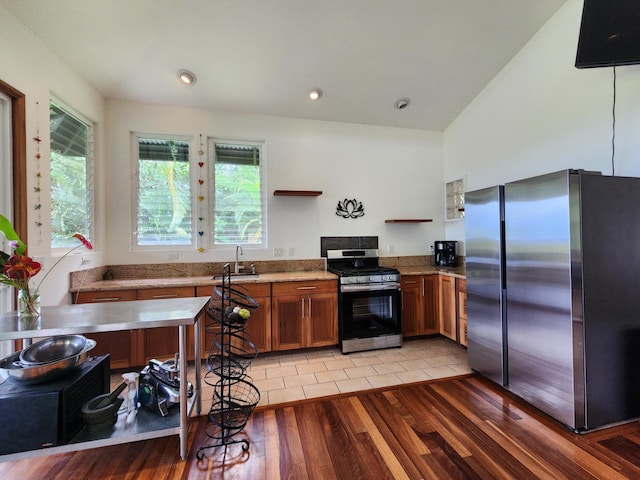 13-831 Malama St, Pahoa, HI 96778 - kitchen featuring stainless steel appliances, brown cabinetry, open shelves, light wood finished floors, and light stone countertops