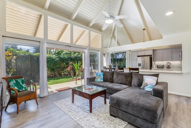 5300 Ka Haku Rd Unit 1, Princeville, HI 96722 - living room with beamed ceiling, light wood finished floors, high vaulted ceiling, and ceiling fan