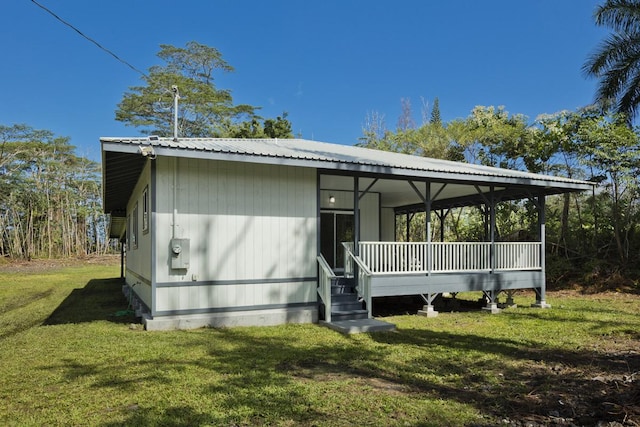 15-1983 27th Ave, Keaau, HI 96749 - rear view of house with a lawn and a porch