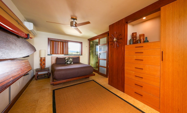 5050 Lawai Rd Unit 413, Koloa, HI 96756 - bedroom featuring a wall unit AC and a ceiling fan