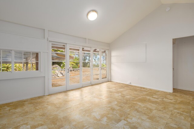 44-3275 Hoo Kahua Rd, Honokaa, HI 96727 - spare room featuring high vaulted ceiling, french doors, and baseboards