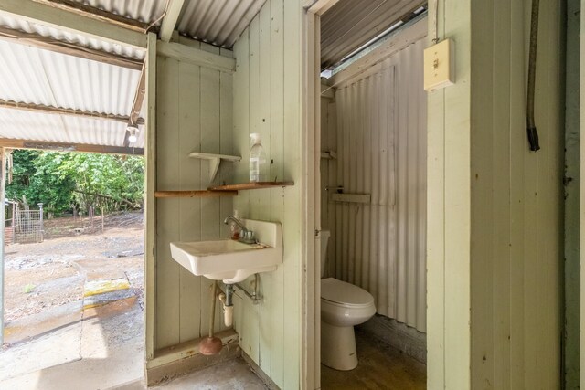 44-3275 Hoo Kahua Rd, Honokaa, HI 96727 - half bath with toilet, concrete flooring, and a sink