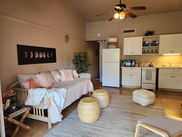 400 Hualani St Unit 5342, Hilo, HI 96720 - living room featuring wood finished floors, a ceiling fan, and high vaulted ceiling