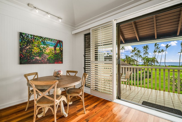 2253 Poipu Rd Unit 162, Koloa, HI 96756 - dining area featuring rail lighting, wood finished floors, and baseboards