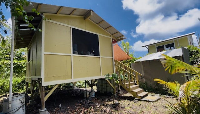 12-7026 Wehelauniu St, Pahoa, HI 96778 - view of property exterior featuring stairs