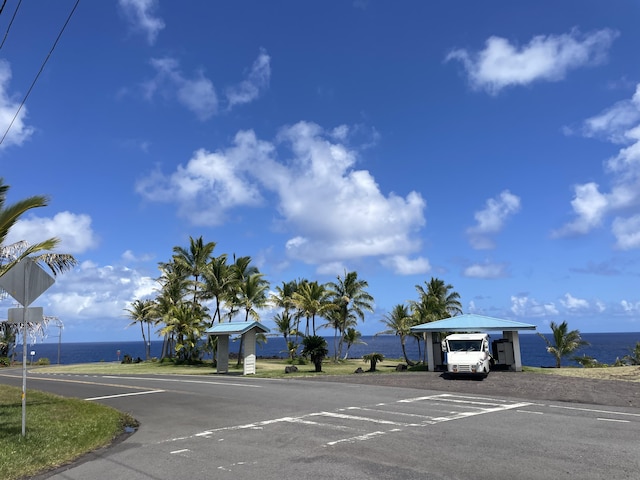 12-7026 Wehelauniu St, Pahoa, HI 96778 - view of asphalt street featuring traffic signs and a water view
