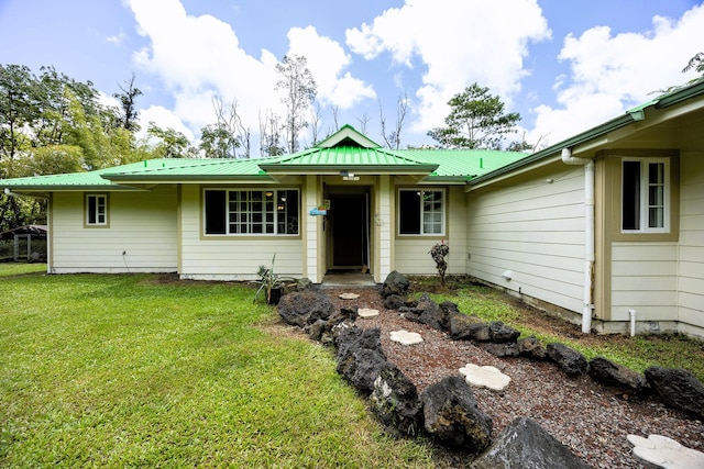13-3477 Alapai St, Pahoa, HI 96778 - ranch-style house featuring a front lawn and metal roof