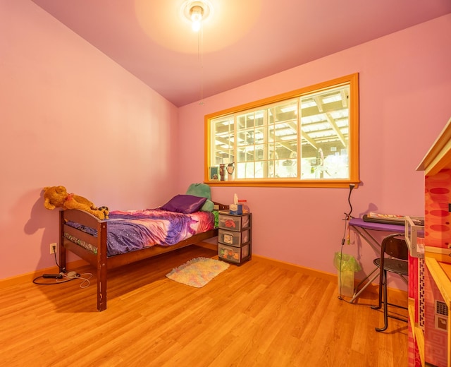 13-3477 Alapai St, Pahoa, HI 96778 - bedroom featuring wood finished floors, lofted ceiling, and baseboards