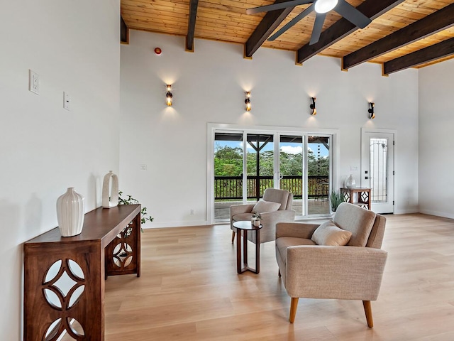 15-2792 Opae St, Pahoa, HI 96778 - living area with a ceiling fan, wooden ceiling with exposed beams, a high ceiling, light wood-style flooring, and baseboards