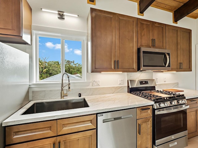 15-2792 Opae St, Pahoa, HI 96778 - kitchen with appliances with stainless steel finishes, beam ceiling, a sink, and light stone counters