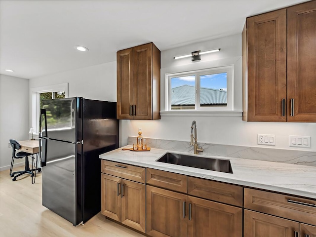 15-2792 Opae St, Pahoa, HI 96778 - kitchen featuring freestanding refrigerator, a sink, healthy amount of natural light, light wood-type flooring, and recessed lighting