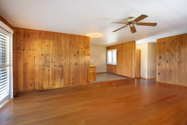 68-1853 W Kaupapa Pl, Waikoloa, HI 96738 - empty room with ceiling fan, wood finished floors, and wooden walls