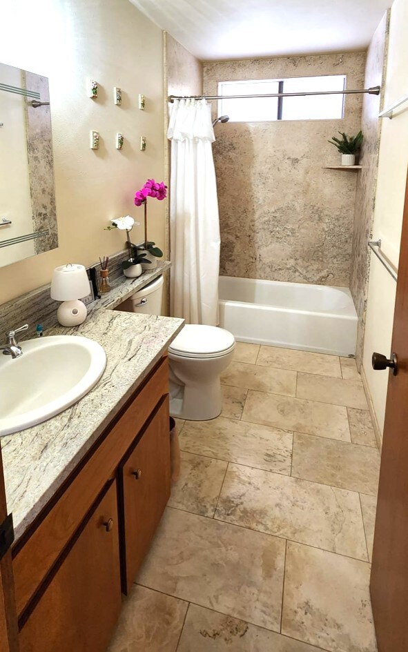 68-1853 W Kaupapa Pl, Waikoloa, HI 96738 - full bath with vanity, shower / tub combo with curtain, and toilet