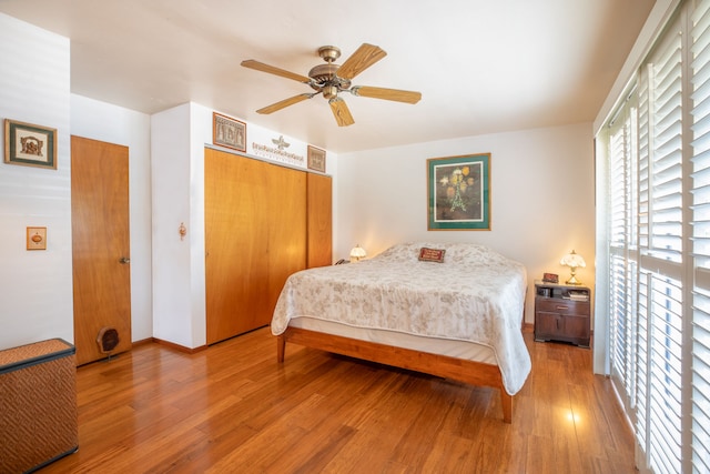 68-1853 W Kaupapa Pl, Waikoloa, HI 96738 - bedroom with wood finished floors, a closet, a ceiling fan, and baseboards