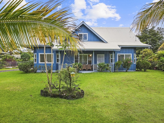 15-1948 12th Ave, Keaau, HI 96749 - view of front facade with a porch and board and batten siding